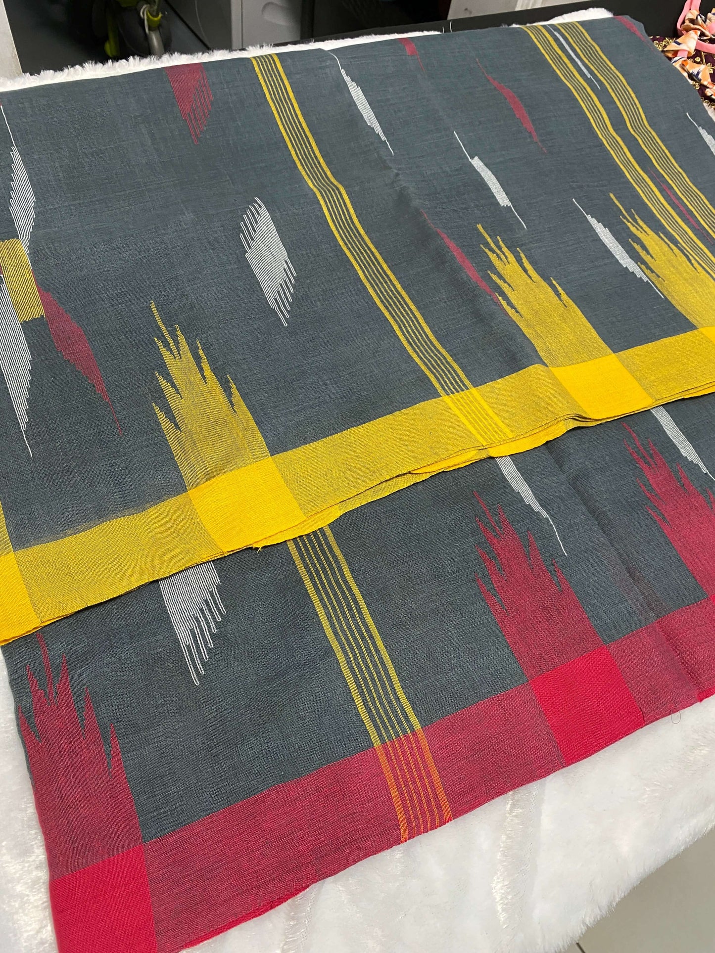 Charcoal Grey Manipuri Handloom Saree with Red and Yellow Accents@Auxerra