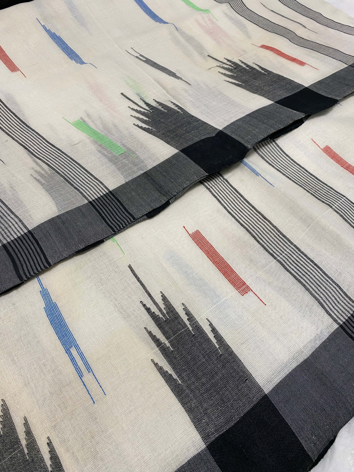 White Manipuri Handloom Saree with Black and Multicolor Accents@Auxerra